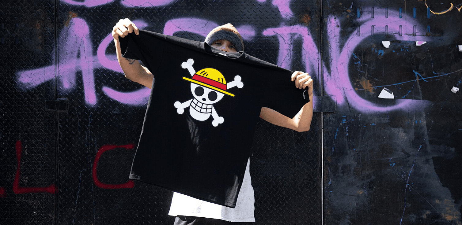 Protestor holding up a T-shirt with a Gen-Z logo, Peru, 25 November 2025